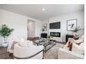 Bright living room with modern fireplace, TV, elegant decor, and stylish seating arrangement at 219 Parker Claire Ln, Kings Mountain, NC 28086