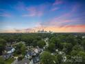 Stunning aerial view capturing the Charlotte skyline and surrounding neighborhood at sunset at 2800 Georgia Ave, Charlotte, NC 28205