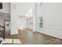 Bright dining room features high ceilings, decorative molding, and natural light from large windows at 2899 Atwater Pond Cir, Denver, NC 28037