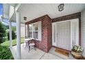 Inviting front porch with brick accents, features a cozy seating area perfect for relaxing at 3908 Parkers Ferry Rd, Fort Mill, SC 29715