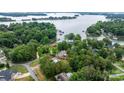 Aerial view showcasing the property's waterfront location and lush surroundings on Lake Norman at 4007 Lake Shore S Rd, Denver, NC 28037