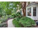 Charming home exterior with lush landscaping and a brick facade at 4007 Lake Shore S Rd, Denver, NC 28037