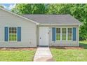 Close up showcasing the front door and exterior of a cozy, charming home at 425 Austin Dr, Charlotte, NC 28213