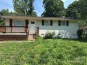 Attractive single-story house featuring a cozy front porch and well-maintained exterior at 5200 Queen Anne Rd, Charlotte, NC 28217