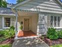 Inviting front porch with brick flooring and a classic exterior at 5436 Topping Pl, Charlotte, NC 28209