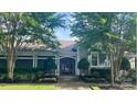 Beautiful clubhouse with well-manicured landscaping, offering a welcoming community gathering space at 8350 Brickle Ln, Huntersville, NC 28078