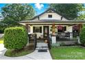 Close up of a charming bungalow style home with covered front porch and meticulous landscaping at 840 10Th Street Nw Blvd, Hickory, NC 28601