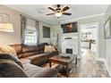 Comfortable living room with fireplace, wood flooring, and open layout to the kitchen at 840 10Th Street Nw Blvd, Hickory, NC 28601