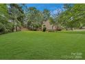 Expansive backyard, great for recreation, entertaining, or simply enjoying nature and outdoor activities at 9040 Scottsboro Dr, Huntersville, NC 28078