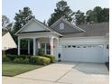 Lovely single-story home with a well-maintained lawn and an attached two-car garage at 919 Lily Magnolia Ct, Fort Mill, SC 29707