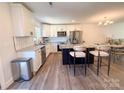 Modern kitchen with white cabinets, stainless steel appliances, and granite countertops at 103 Springway Dr, Kannapolis, NC 28081