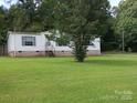 Exterior of home featuring brick base and green shutters at 111 Crystal Creek Dr, China Grove, NC 28023