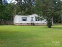 Exterior of home featuring brick base and green shutters at 111 Crystal Creek Dr, China Grove, NC 28023