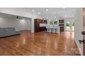 Spacious open-concept living area flows into a kitchen with modern stainless steel appliances at 1115 Sides Rd, Salisbury, NC 28146