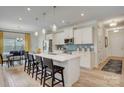 Modern kitchen with quartz countertops, stainless steel appliances, and eat-in island at 1254 Langston Ln, Salisbury, NC 28144
