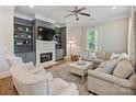 Bright living room showcasing a fireplace, built-in shelving, and comfortable seating at 1325 Kennon St, Charlotte, NC 28205