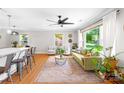 Bright living room featuring hardwood floors, a large window, comfortable seating, and natural light at 2919 Dunaire Dr, Charlotte, NC 28205