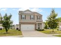 Charming two-story home with gray facade, a two-car garage, and well manicured front yard at 331 Gaines Rd, Clover, SC 29710