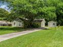 Inviting single-story home with well-maintained lawn, long driveway, and convenient storage shed at 4333 Dunwoody Dr, Charlotte, NC 28215