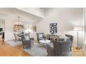 Bright living room featuring modern decor and high ceilings at 4442 Coventry Row Ct, Charlotte, NC 28270