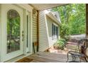 Welcoming front porch with decorative glass door and charming exterior details at 500 Mount Pleasant N Rd, Mount Pleasant, NC 28124