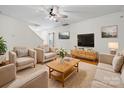 Cozy living room with comfortable seating, fan and media center at 6803 Ware Rd, Charlotte, NC 28212