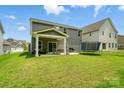 Spacious backyard with a covered patio, perfect for outdoor entertaining at 812 Dogwood Creek Ln, Indian Trail, NC 28079