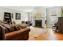 Inviting living room showcasing a fireplace, hardwood floors and stylish furniture at 1009 13Th Avenue Nw Pl # 19, Hickory, NC 28601