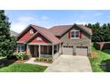 Charming two-story home with a welcoming front porch and well-manicured lawn, inviting curb appeal at 1152 Mckee Farm Ln, Belmont, NC 28012