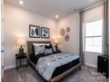 Cozy bedroom featuring a stylishly decorated bed and ambient lighting at 1211 Morehead Dr, Salisbury, NC 28144