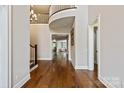 Grand foyer with hardwood floors, staircase, and open views to living spaces at 1233 Ladera Dr, Waxhaw, NC 28173