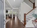Inviting foyer featuring hardwood floors, elegant staircase, and an open view to the living area at 124 Slocumb Ln, Mooresville, NC 28117