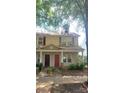 Charming two-story townhome with inviting front porch and well-maintained landscaping at 12450 Stone Garden Dr, Huntersville, NC 28078