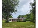 Charming single-story brick home with a well-manicured lawn and inviting curb appeal at 125 Heritage View Rd, Hickory, NC 28601