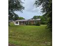 Charming single-story brick home with a well-manicured lawn and inviting curb appeal at 125 Heritage View Rd, Hickory, NC 28601