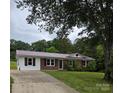 Charming single-story brick home with a well-manicured lawn and inviting curb appeal at 125 Heritage View Rd, Hickory, NC 28601