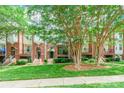 Charming townhome exterior with well-maintained lawn and mature trees at 14222 Richmond Park Ave, Charlotte, NC 28277