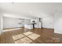 Open-concept living room with hardwood floors and a bright and inviting atmosphere at 1450 Mammoth Rd, Hickory, NC 28602