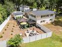 A backyard designed for entertaining, featuring a fire pit and covered seating areas at 1505 Clarendon Pl, Rock Hill, SC 29732