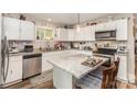 Updated kitchen featuring granite countertops, white cabinets, and stainless steel dishwasher at 161 Ranson Rd, Lancaster, SC 29720