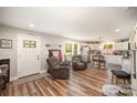 Open-concept living area with hardwood floors, modern furnishings, and natural light at 161 Ranson Rd, Lancaster, SC 29720