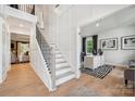 Elegant staircase with black metal railing and white trim leads to a bright office space at 204 Coronado Ave, Matthews, NC 28104