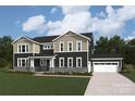 Beautiful two-story home with a three-car garage and professionally landscaped yard at 2541 Mabel Ln, Monroe, NC 28110