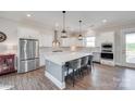 Bright kitchen with white cabinets, stainless steel appliances, and a large island with seating at 264 Auburn View Rd, Rock Hill, SC 29730