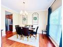 Bright dining room featuring hardwood floors, elegant chandelier, and traditional furniture at 4048 Cascade Dr, Gastonia, NC 28056