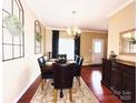Elegant dining area with hardwood floors, modern lighting, and stylish decor at 4048 Cascade Dr, Gastonia, NC 28056