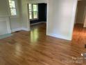 Bright living room with hardwood floors, a fireplace, and ample natural light at 419 W 8Th St, Newton, NC 28658
