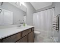 Functional bathroom showcasing a vanity with solid surface countertops, a shower and tub at 440 Shallowford Dr, Rock Hill, SC 29732