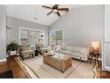 Bright living room with vaulted ceiling, natural light, and access to balcony at 5730 Closeburn Rd # N, Charlotte, NC 28210
