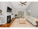 Cozy living room with fireplace, vaulted ceiling, and neutral decor at 5730 Closeburn Rd # N, Charlotte, NC 28210